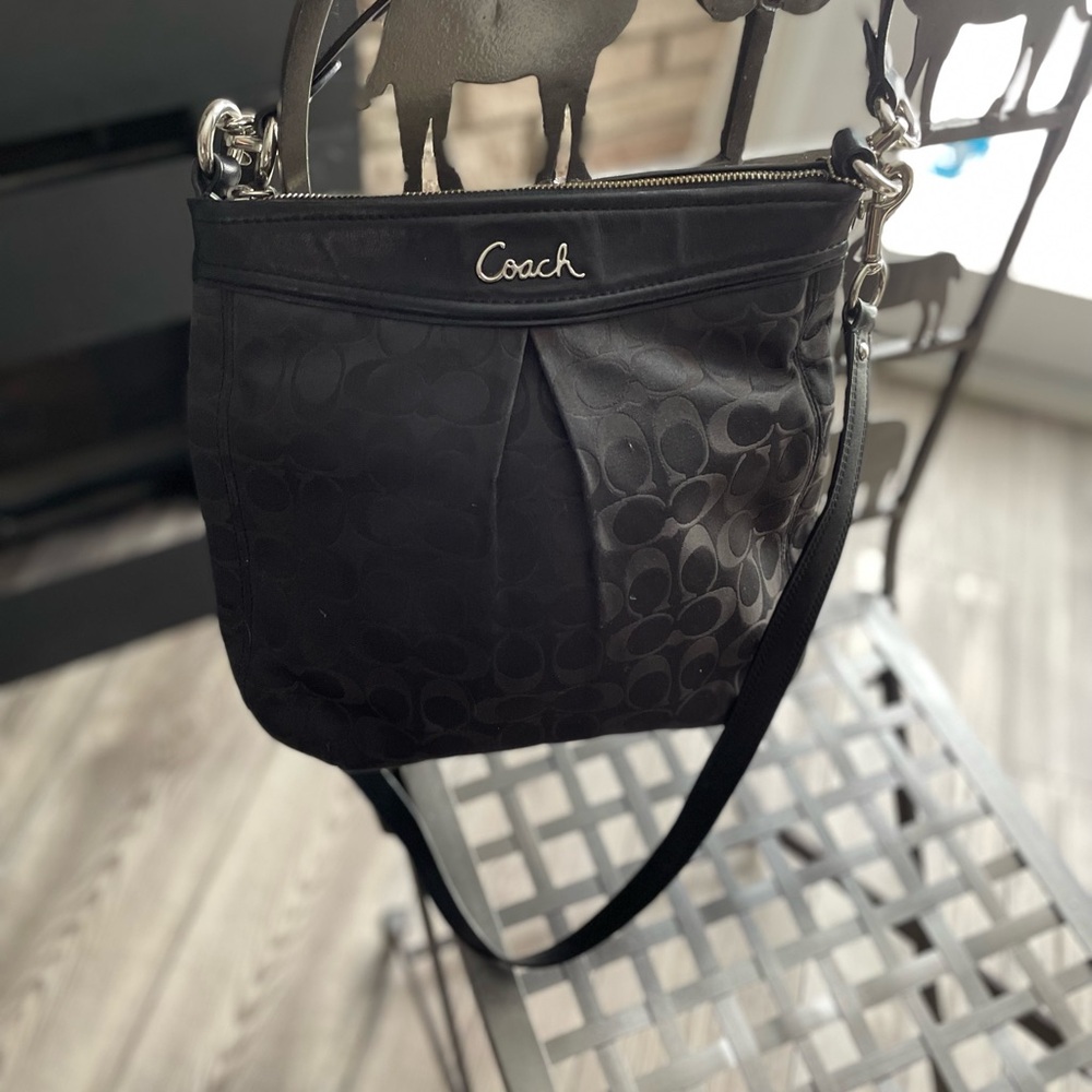 Coach signature crossbody bag – black, silver hardware, zip top.